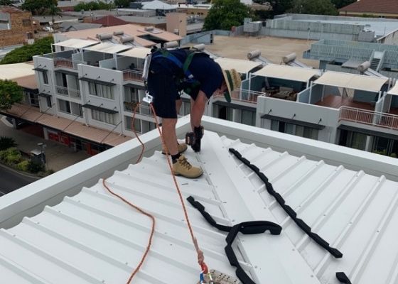 RTL Trades Roofer completing a roof install RTL Trades Roofer completing a roof install